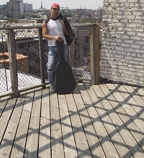 Steve holding guitar