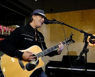 Steve holding guitar